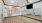 a room with a large screen and a wood floor