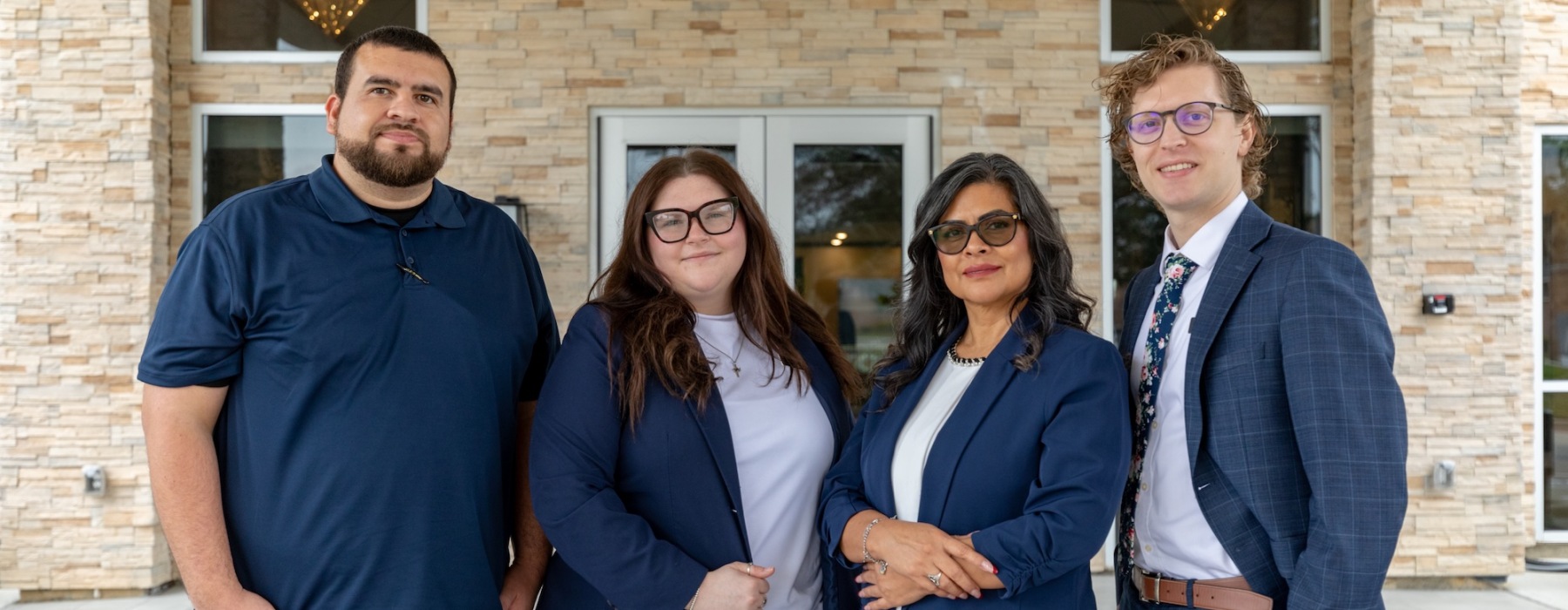 a group of people standing in front of a building