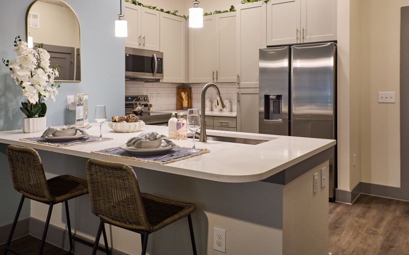 A kitchen with a dining bar