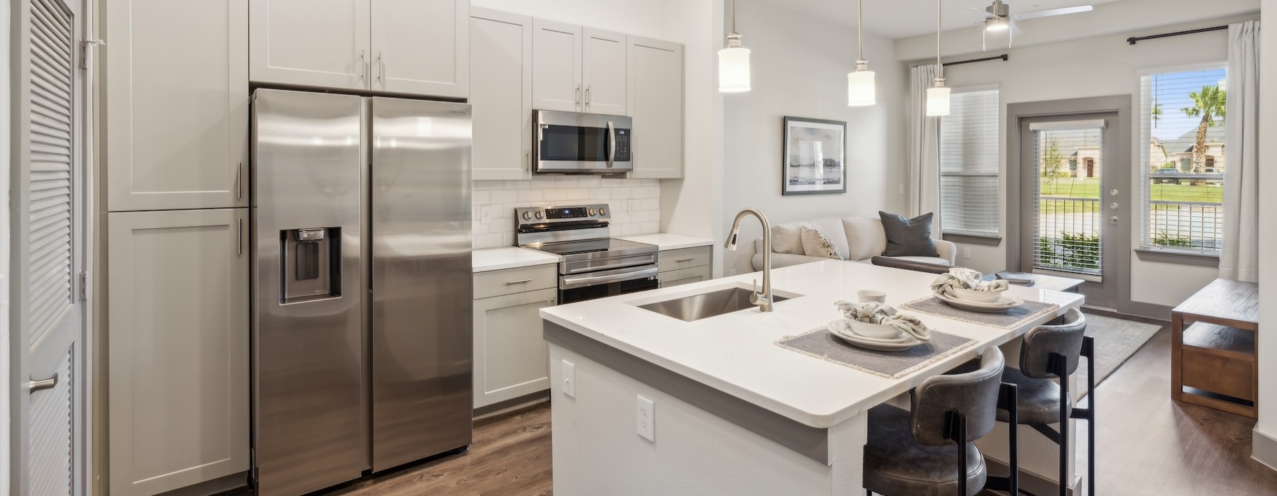 a kitchen with white cabinets
