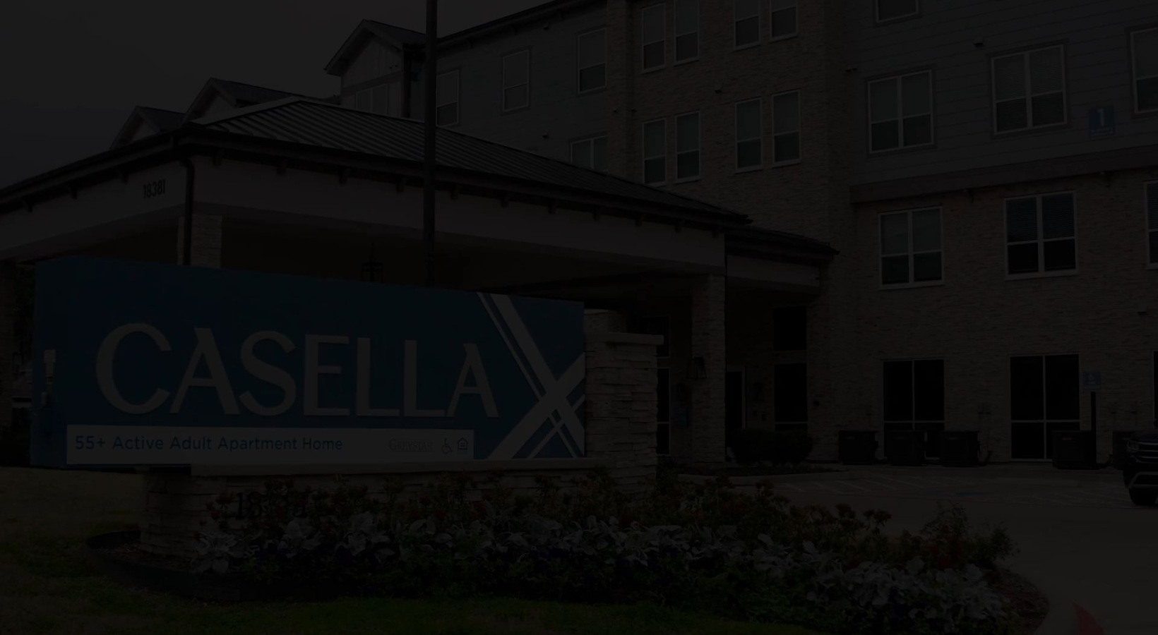 a sign in front of a building