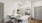 a kitchen with a table and chairs