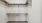 a metal shelf with a metal bar