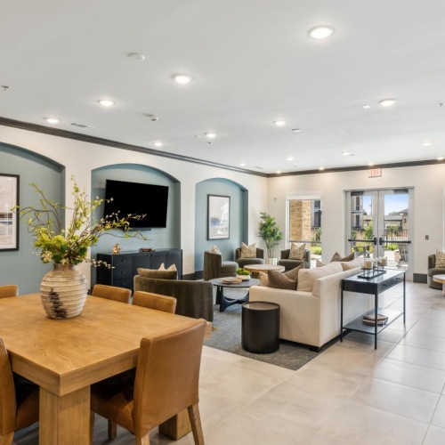 a large room with a table and chairs